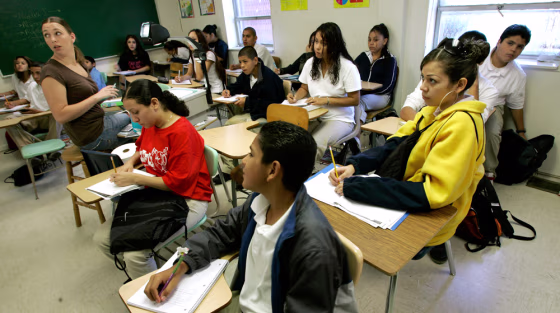 Students listen as teacher Jennifer Morelock explains an algebra problem at Alta Vista Charter School in Kansas City, Mo., on Sept. 15. The school is largely Hispanic — indicative of a&nbsp;broader trend toward more minority students.