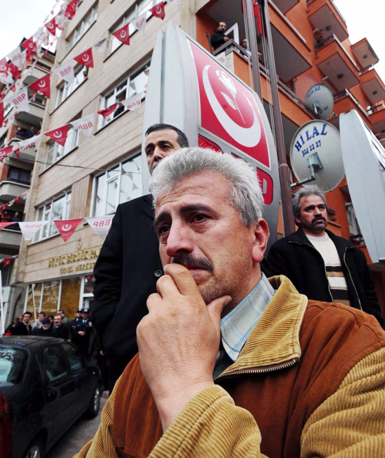 Image: Party members waits outside the party headquarters