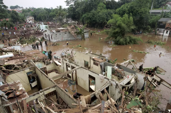 Image: A view of the damage after a flood on the outskirts of Jakarta