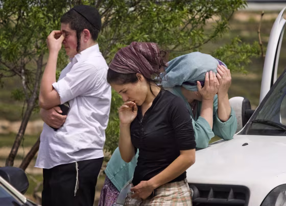 Image: Image: Jewish settlers mourn after attack in Jewish settlement of Bat Ayin