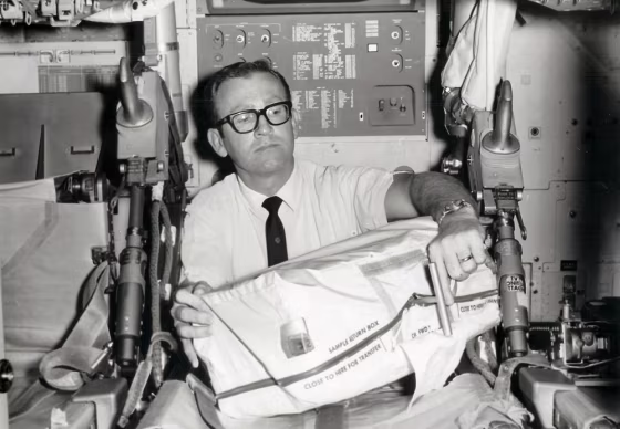 Walter T. Davey sits in a non-flight mockup of the Apollo CSM (Command and Service Module) while conducting engineering design reviews with NASA crewmembers in Downey, Calif. in&nbsp;1969.
