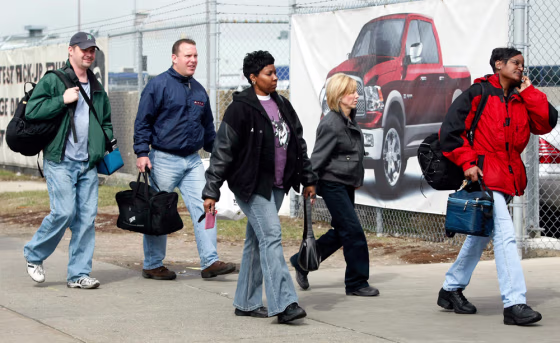 Image: Chrysler LLC auto workers arrive for their shift at the Warren Truck plant in Warren