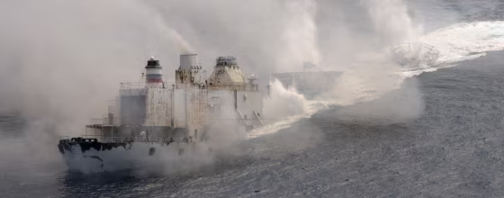 The Gen. Hoyt S. Vandenberg disappears beneath the surface of the ocean after cutting charges were detonated Wednesday, seven miles off Key West, Fla. The 523-foot-long ship, a World War II-era relic, was sunk to create an artificial reef to attract recreational divers and anglers. 