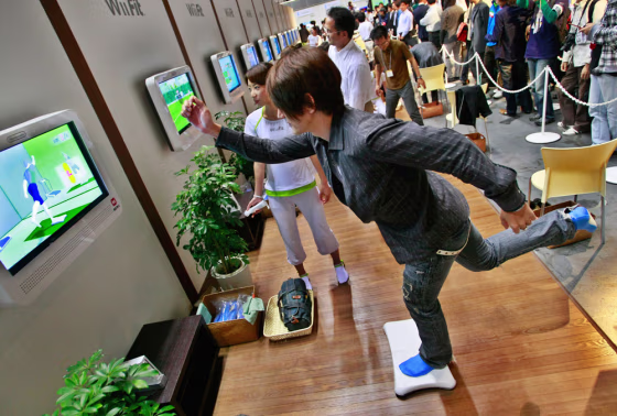 Image: A model demonstrates Nintendo Co.'s game \"Wii Fit\"
