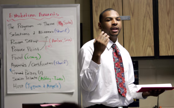 Image: Angelo Drummond, a 17-year-old junior at MetEast High School in Camden, N.J., presents his class project of designing and funding a lounge for teenagers to classmates