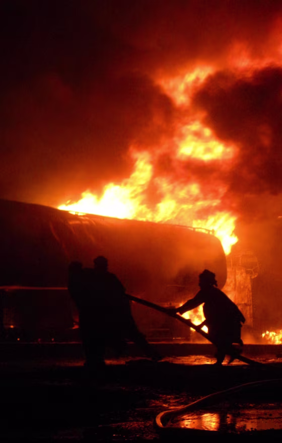 Image: Pakistani firefighters battle with a fire, after an explosion, in Chaman, a Pakistani town along the Afghan border