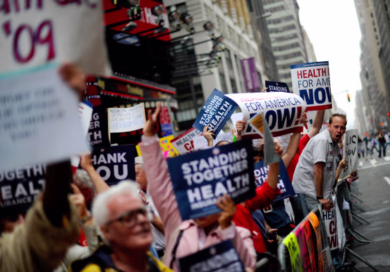 Image:  People attend a rally supporting the passage of health care bills