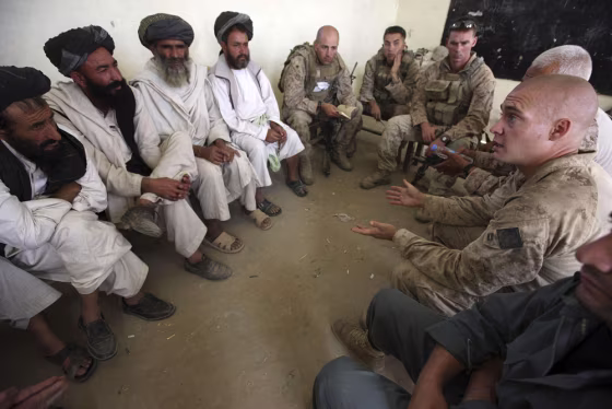 Image: Marines discuss humanitarian projects in Helmand province