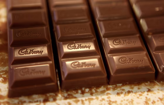 Image: Chocolate moves down the production line at the Cadbury factory
