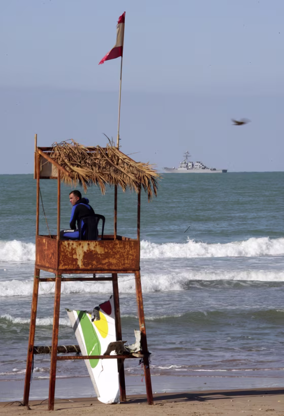 Image: Searching for debris at a beach in Beirut