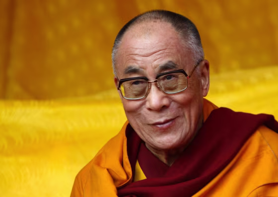 Image: Tibetan spiritual leader the Dalai Lama watches a dance performance on the last day of his teachings in Tawang