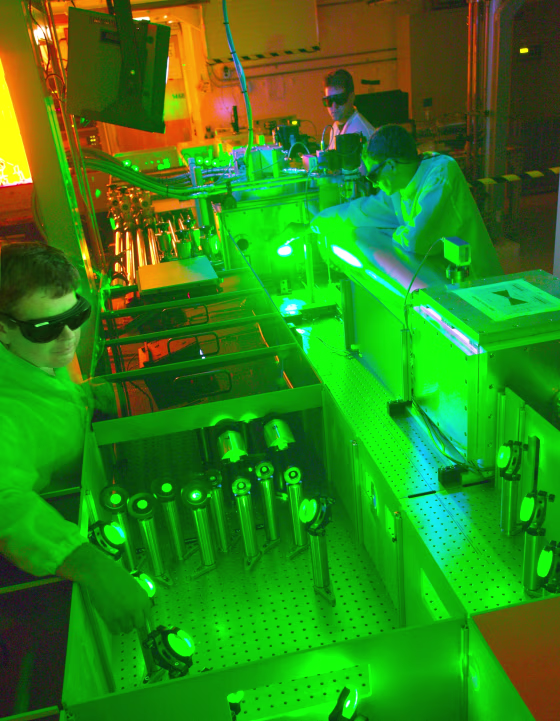 In this 2010 photo, Berkeley Lab researchers work on a 40-terawatt laser that could help blaze a trail for a new breed of particle accelerator.