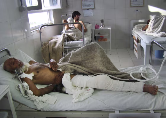 Image: An Afghan man recuperates from his injuries