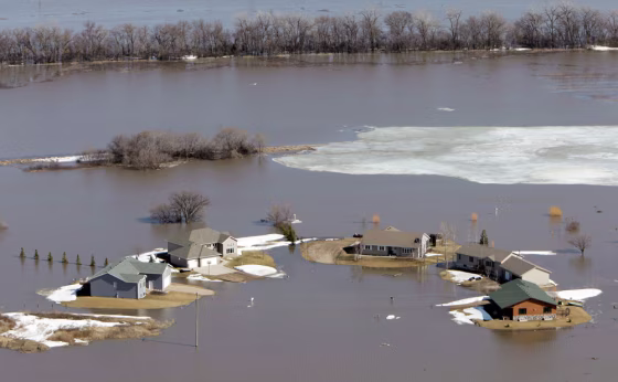 Image: Homes in the Lake Shore subdivision are surrounded by flood waters