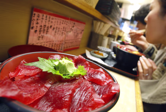 Image: Pieces of Atlantic bluefin tuna are spread atop a rice bowl at a restaurant inside Tsukiji wholesale market in Tokyo