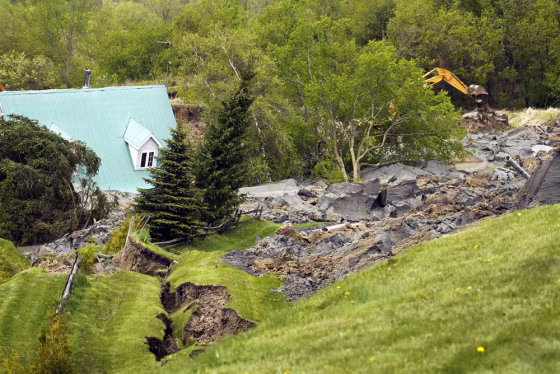 Image: A house is seen after it was destroyed by a landslide in Saint-Jude