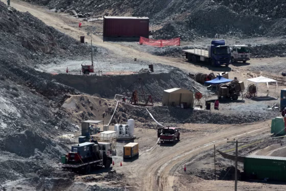 Image: A drill machine, the Xtrata 950, is prepared to start works on the top of a hill where 33 miners are trapped underground in a copper and gold mine at Copiapo