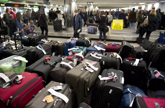 Image: Unclaimed bags in the foreground as trav