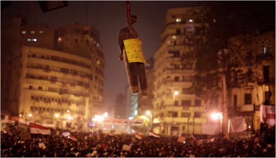 An effigy of President Hosni Mubarak hung from a traffic light in Tahrir Square in Cairo on Tuesday.