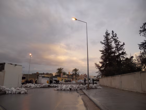 A common street scene in Misurata, with sandbag barricades and armed local residents standing guard