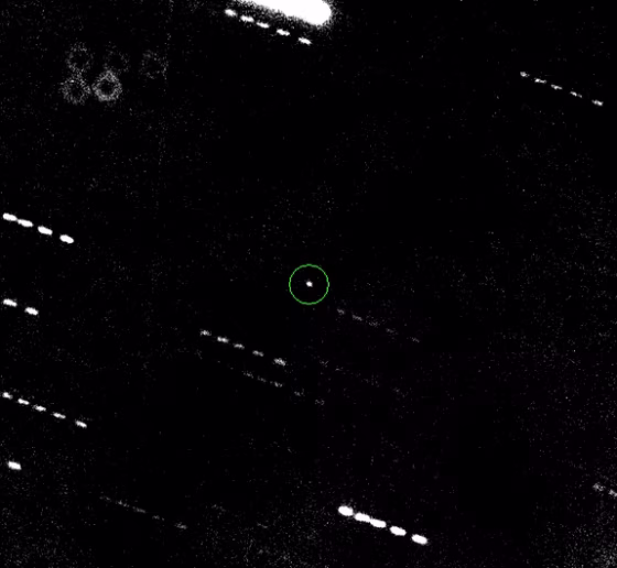 The potentially dangerous asteroid Apophis (circled) is seen&nbsp;in a composite of five exposures taken Jan. 31 through a telescope in Hawaii. The doughnut in the upper left corner is an artifact caused by a dust speck on the camera.