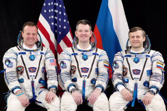 NASA astronaut Ron Garan, left, and Russian cosmonauts Alexander Samokutyaevn, center, and Andrey Borisenko pose for&nbsp;while clad in Russian Sokol spacesuits.The crew's launch on the Soyuz TMA-21 capsule to visit the International Space Station for Expedition 27 has been delayed.
