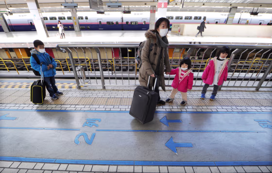 Image: Women and Children Leave Tokyo Over Radiation Concerns