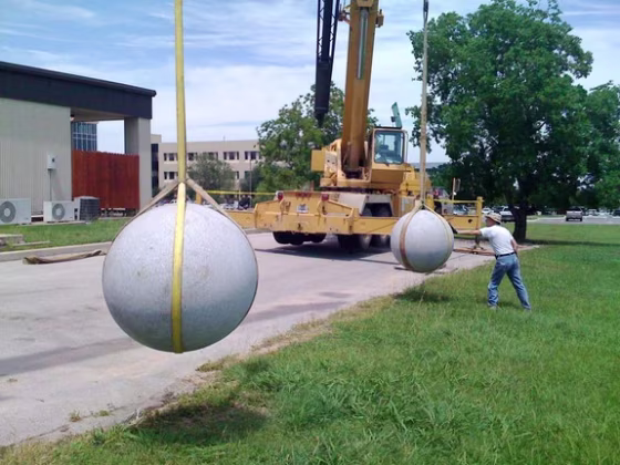 Two 40-foot cranes suspend two granite balls —which average&nbsp;2,700 pounds each —&nbsp;as they prepare for impact. The experiment at the Southwest Research Institute in Boulder, Colo., was meant&nbsp;to mimic asteroid collisions.
