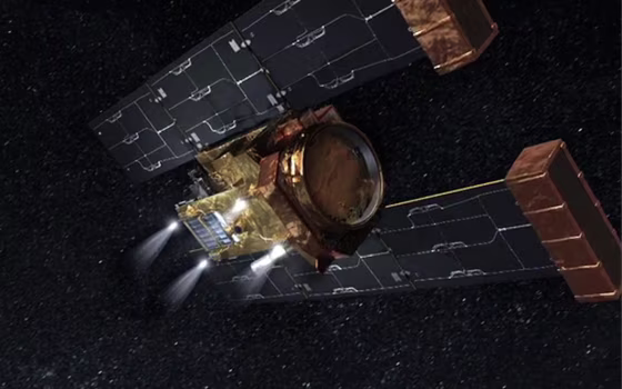 An artist's conception shows the Stardust spacecraft's four rocket motors firing for the last time.