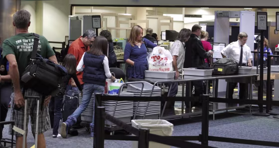 Image: Passengers line up at a security checkpoint operated by the TSA at Fort Lauderdale-Hollywood International Airport in Fort Lauderdale