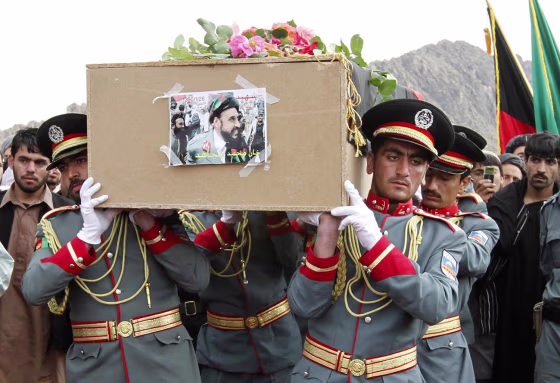 Image: Afghan National Police honor guards carry a coffin of slain police chief of Afghanistan's southern Kandahar province