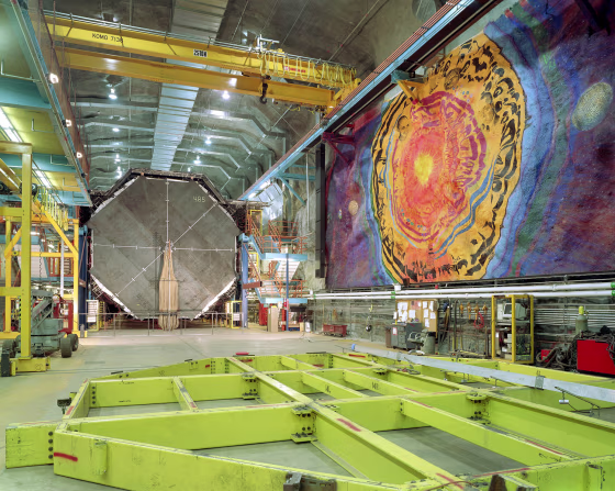 The MINOS experiment is in a cavern half-a-mile deep in the Soudan Underground Laboratory, Minnesota. A mural of famous scientists is painted on the rock wall.