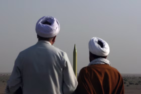 Image: 

Iranian clerics look at a ballistic missile Shahab 1 before being launched during the second day of military exercises