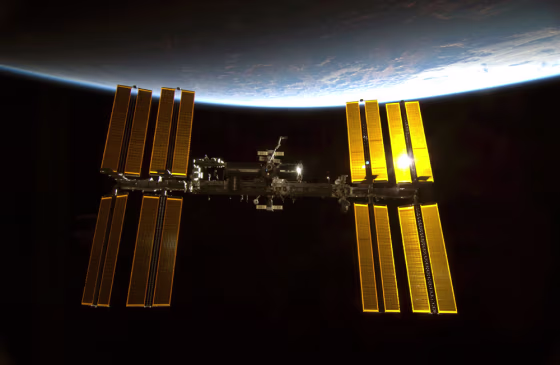 Sunlight glints off the International Space Station with the blue limb of Earth providing a dramatic backdrop in this photo taken by an astronaut on the shuttle Endeavour just before it docked after midnight on Feb. 10, 2010, during the STS-130 mission.
