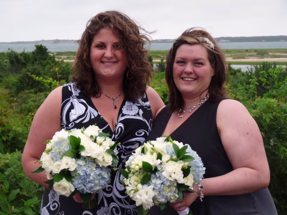 Image: Ashley Abraham-Hughes, left, and her wife, Corinne