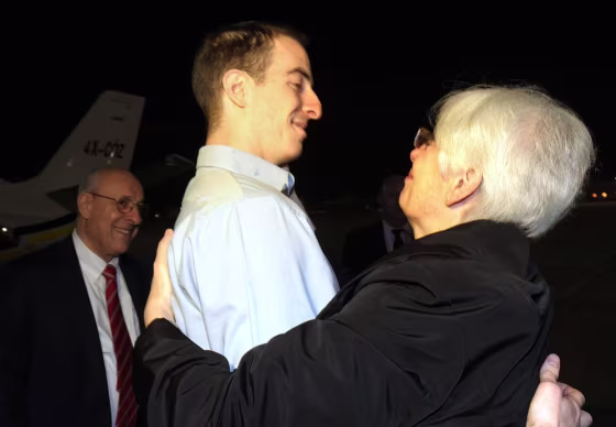 Image:  Ilan Grapel (C), a US-Israeli citizen accused of spying in Egypt, hugging his mother Irene