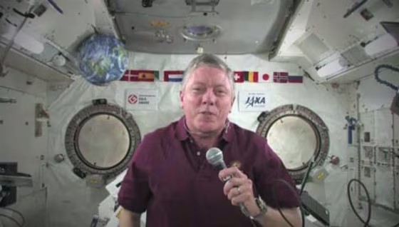 NASA astronaut Mike Fossum, commander of the Expedition 29 crew on the International Space Station, offers a video tribute to armed servicemen and women for U.S. Veterans Day on Friday.