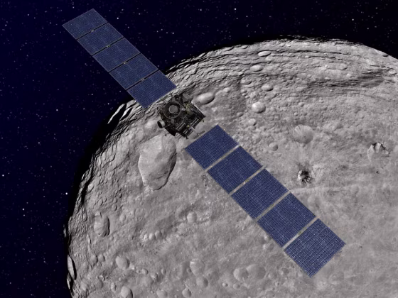 This artist's concept shows NASA's Dawn spacecraft orbiting the giant asteroid Vesta.