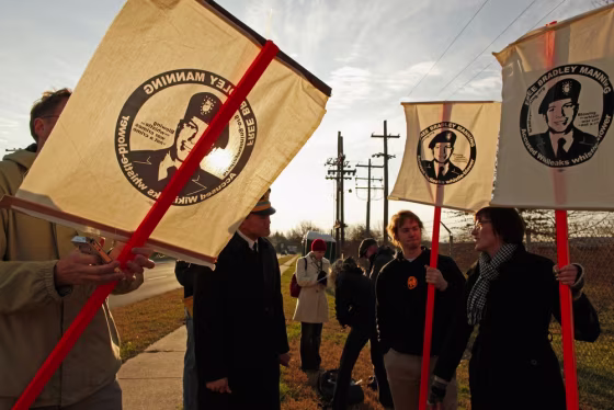 Image: Supporters of U.S. Army Private Bradley Manning, an Army intelligence analyst, hold vigil outside the gates of U.S. Army Fort George G. Meade,