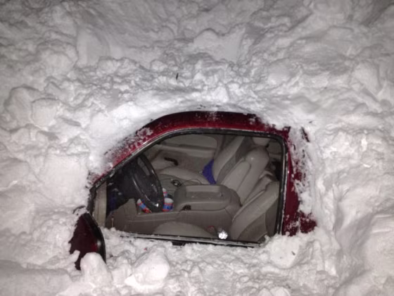 Image: car in snowdrift after Texas family was rescued