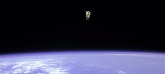 An astronaut floating above Earth.