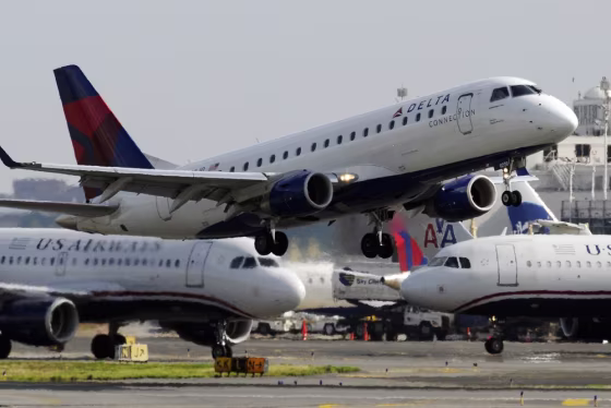 Image: A Delta Airlines jet takes off from Washington's Reagan National Airport in Alexandria, Virginia