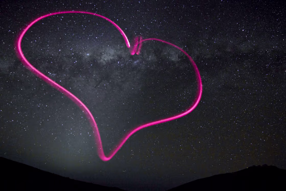 Astronomer and photographer Julien Girard drew the heart in the air with a tiny flashlight at ESO's Paranal Observatory in northern Chile. The VLT telescopes are barely visible on the hill at lower right. The photo was taken on Oct. 20, 2011 and released by ESO officials on Monday.