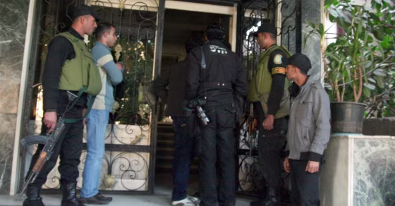Egyptian military stand guard as officials raid a non-governmental organization offices in Cairo.