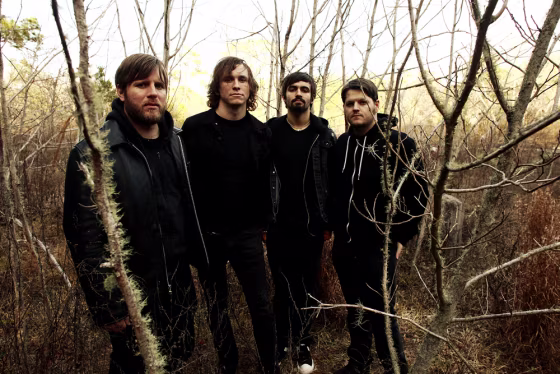 Against Me! band members support a library with independent works in Gainesville, Fla. From left, Andrew Seward, Tom Gabel, Jay Weinberg, James Bowman.