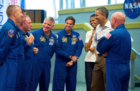 President Barack Obama and first lady Michelle Obama share a laugh with STS-134 space shuttle Endeavor commander Mark Kelly (with back to camera), right, and shuttle astronauts, from left, Andrew Feustel, European Space Agency’s Roberto Vittori, Michael Fincke, Gregory H. Johnson, and Greg Chamitoff, after their launch was scrubbed on&nbsp;April 29, 2011, at Kennedy Space Center in Cape Canaveral, Fla.