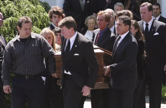 Image: Mary Kennedy's casket is carried out of St. Patrick's Church by family after her funeral service concluded in Bedford