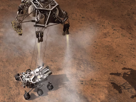 This artist's concept depicts the Sky Crane lowering NASA's Curiosity rover onto the Martian surface.