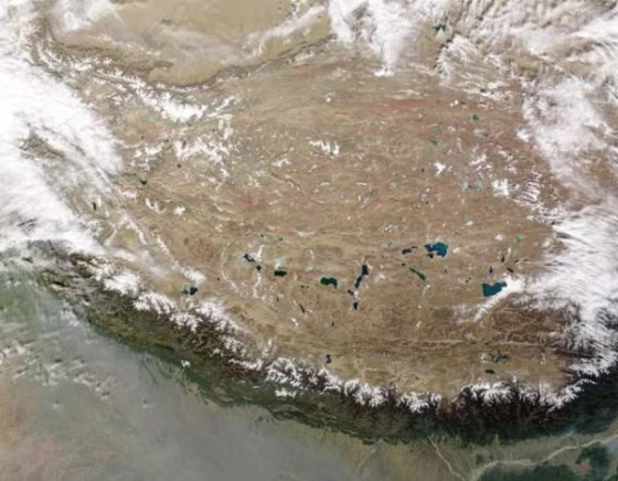 What's going on under there? The whole of the Tibetan Plateau, in true color, captured by satellite. The Himalayas can be seen along the bottom edge of the image.