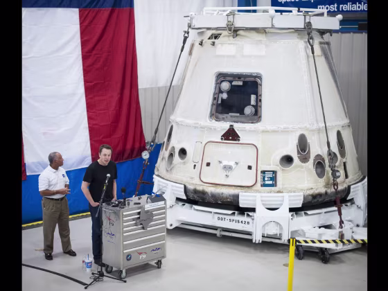 NASA Administrator Charles Bolden, left, and SpaceX Chief Executive Officer Elon Musk view the historic Dragon capsule that returned to Earth on May 31 following the first successful mission by a private company to carry supplies to the International Space Station. This picture was taken June 13, 2012 at a SpaceX facility in McGregor, Texas.